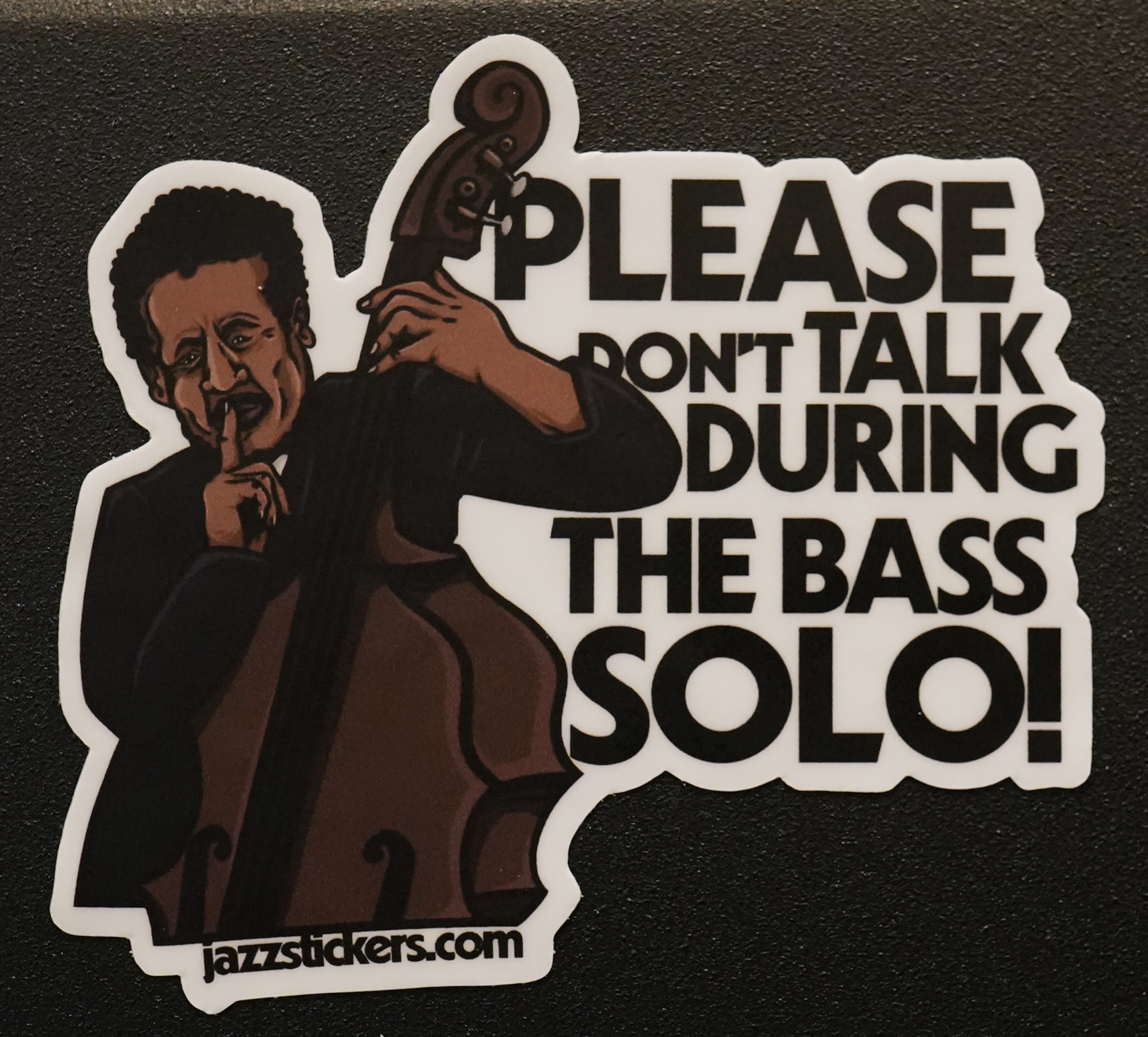 sticker that reads: don't talk during the bass solo