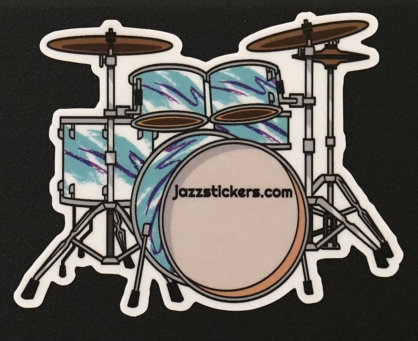 sticker of drumset with teal and purple sides